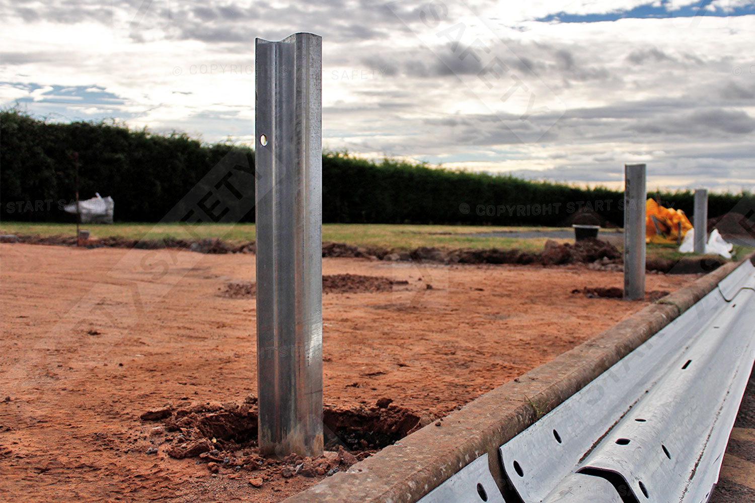 Armco barrier z-section post being installed