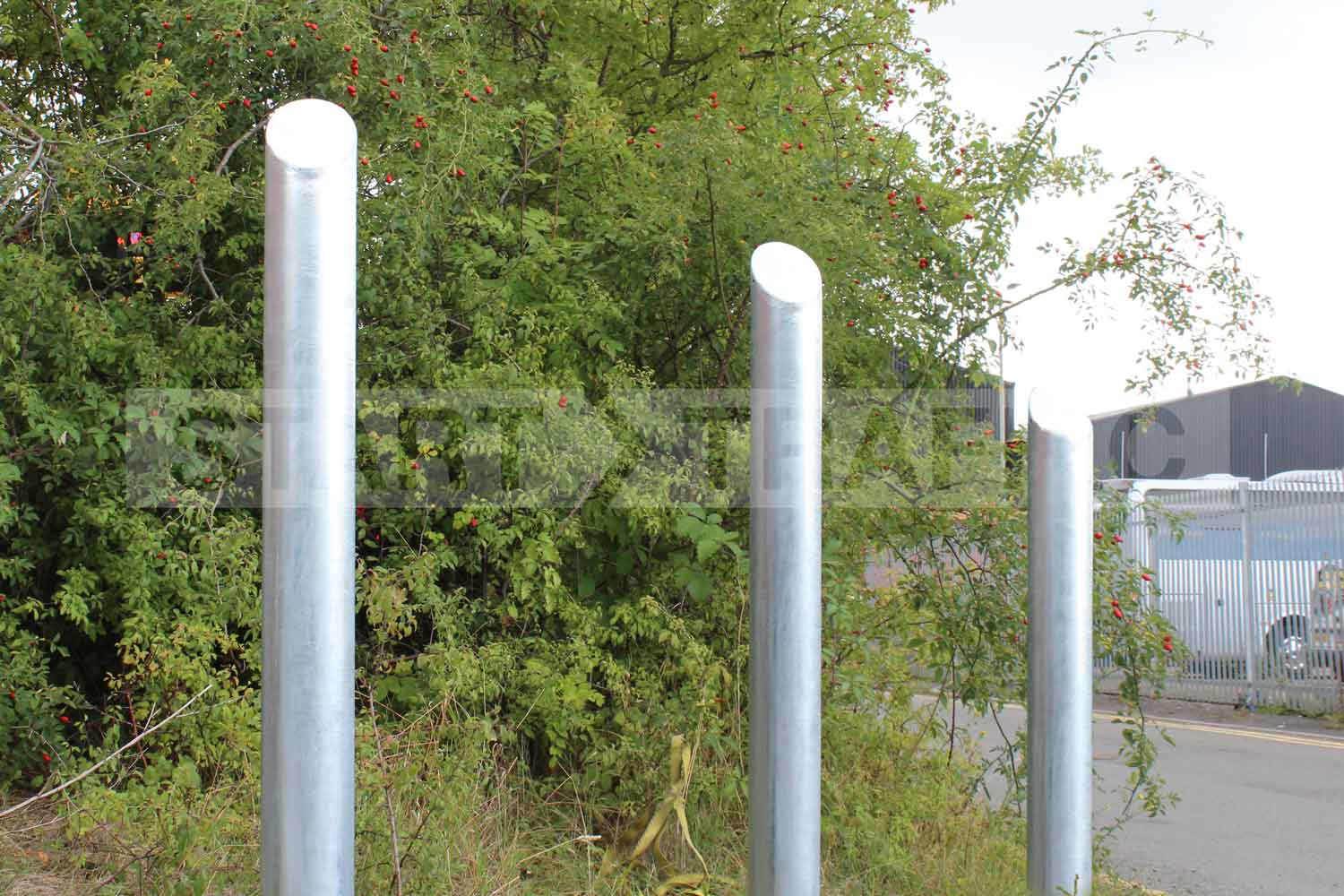Mitre-Top bollards being used to protect soft verge