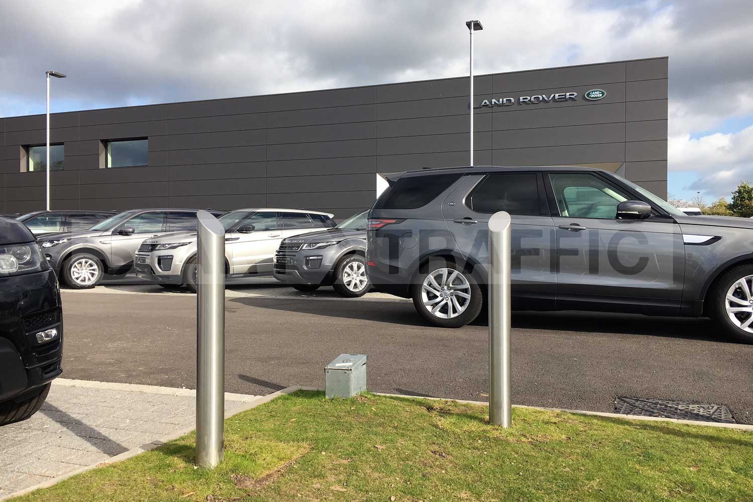 Stainless mitre top bollards installed at a Land Rover garage