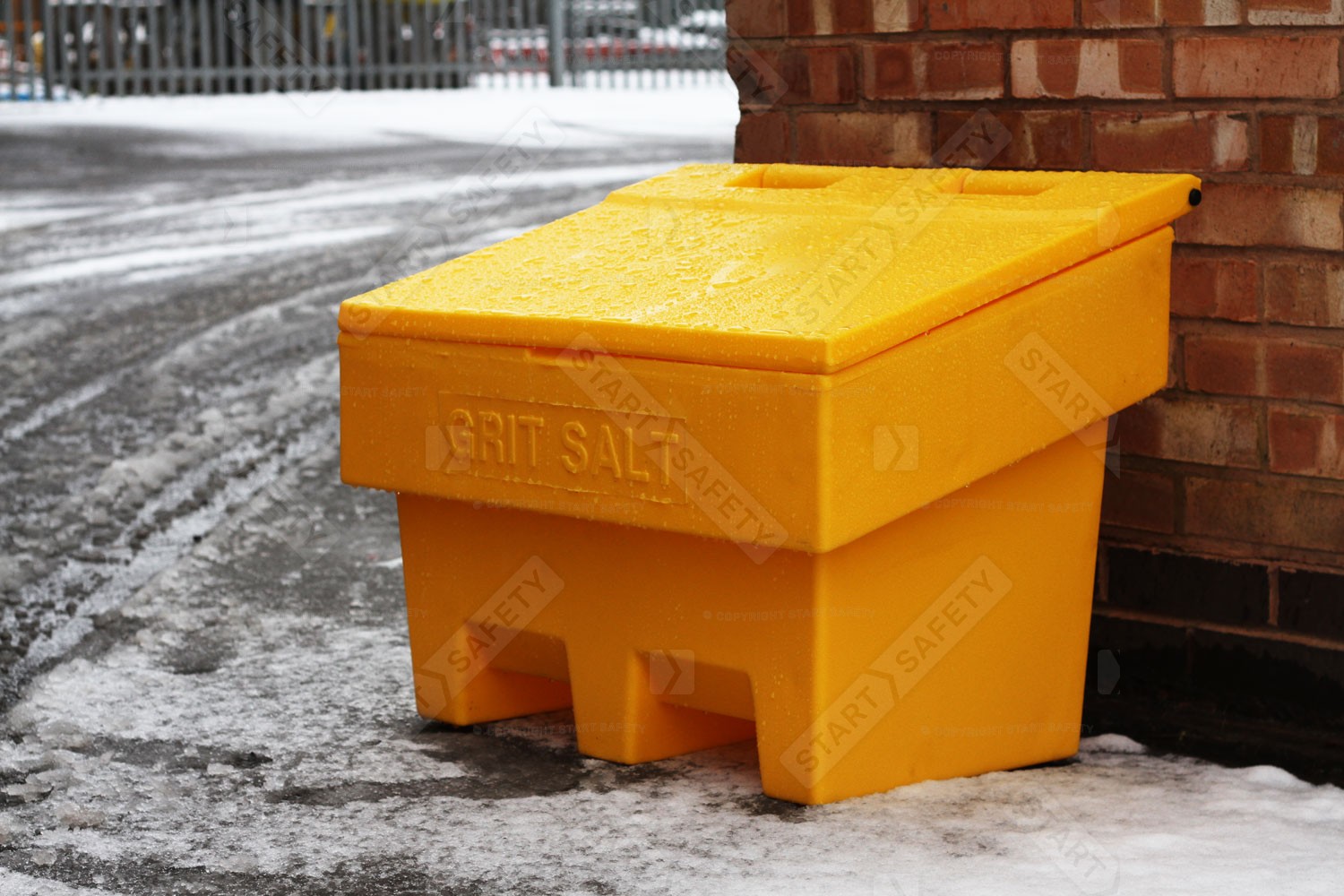 Highly Visible Yellow 100 Litre Grit Bin In A Snowy & Icy Environment