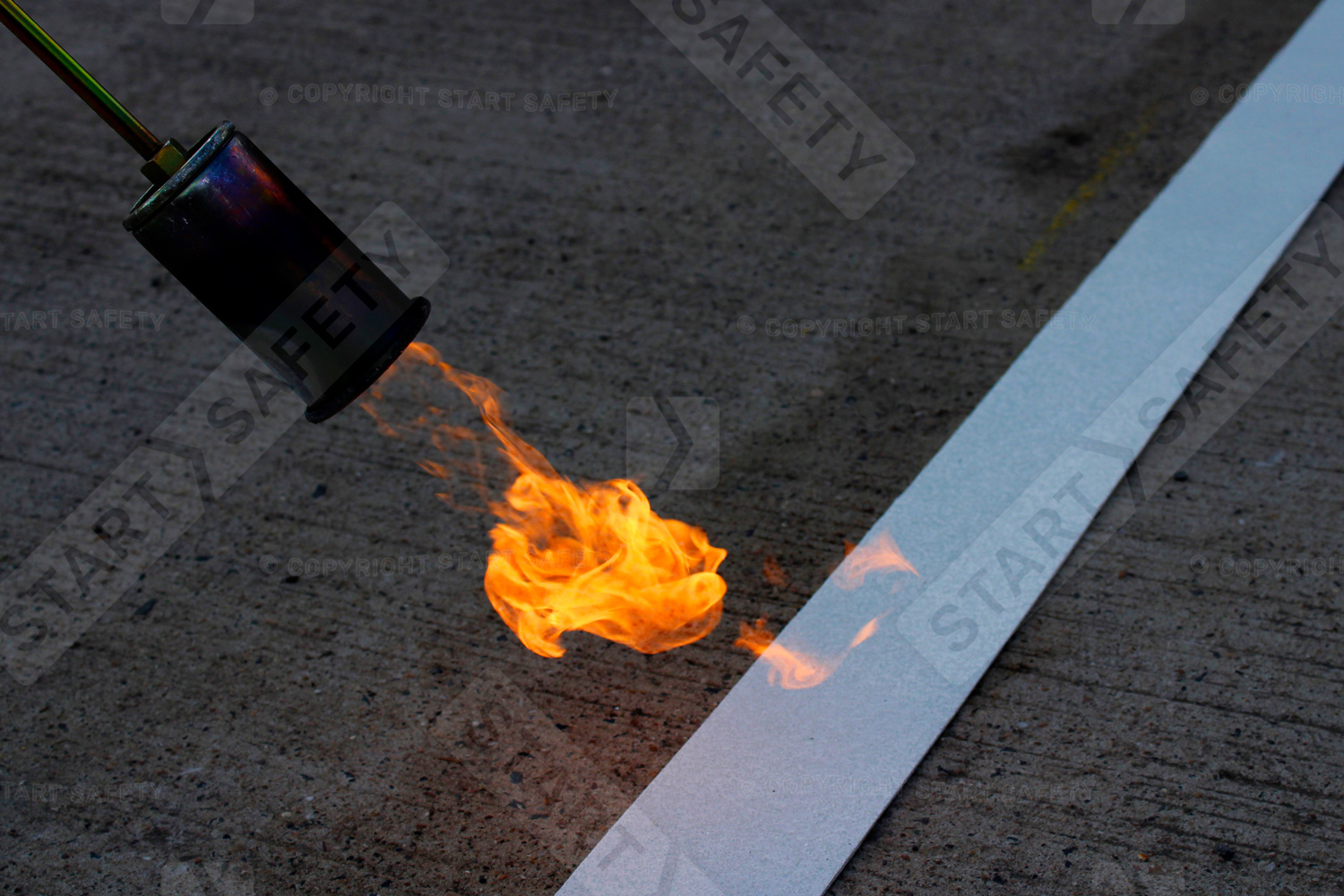 Thermoplastic marking being applied using gas burner